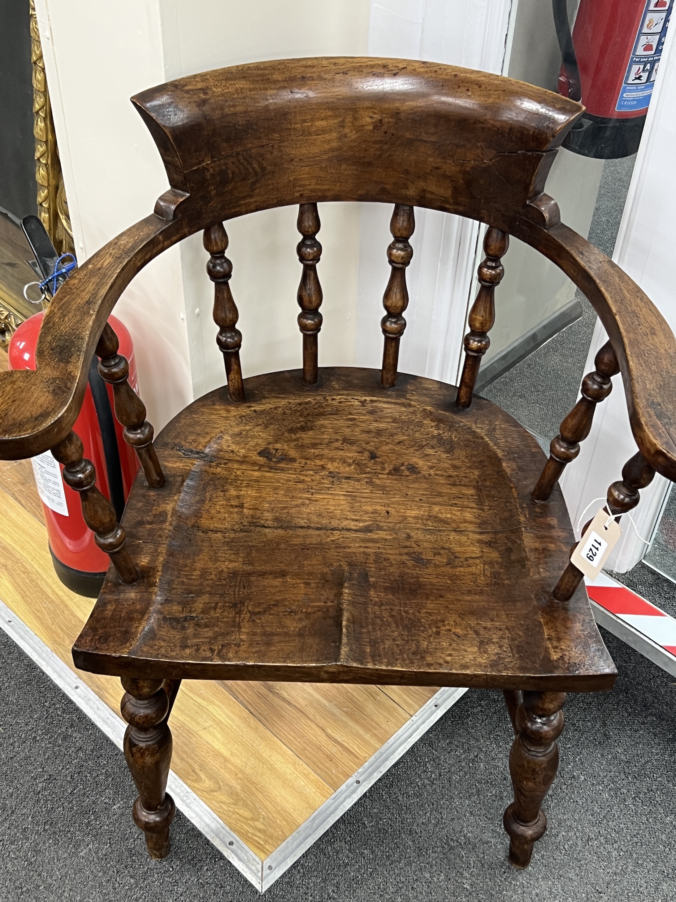 A Victorian style smoker's bow elbow chair, width 72cm, depth 47cm, height 84cm